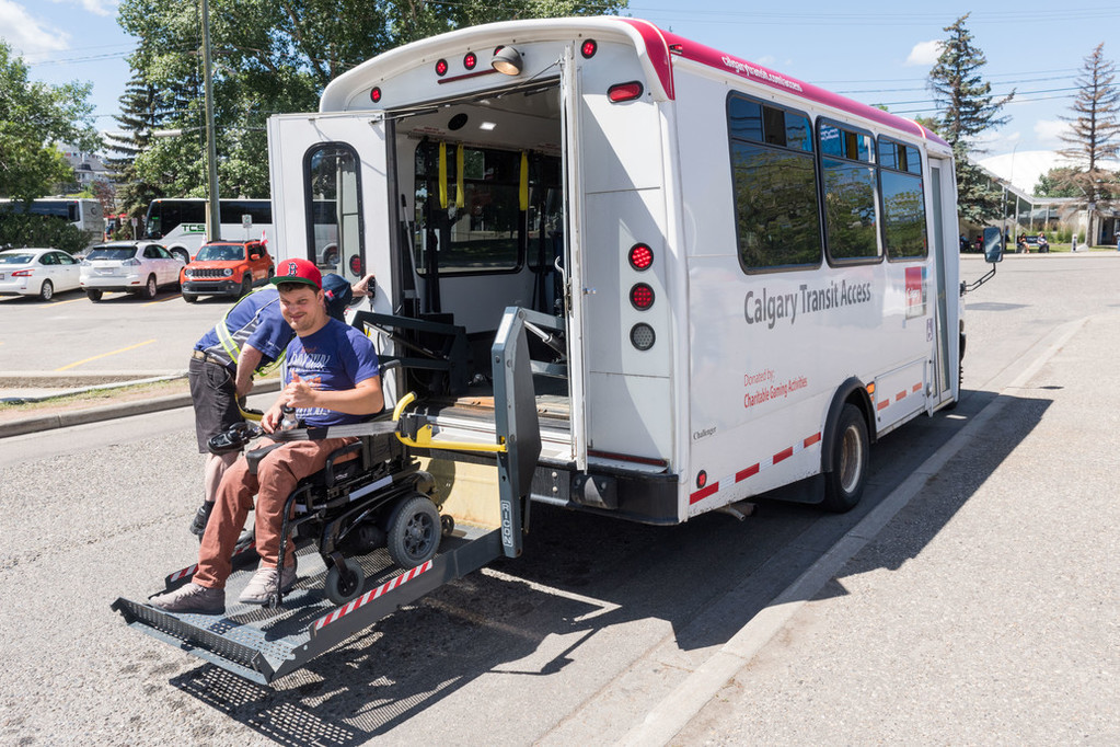 woman being assisted on ramp