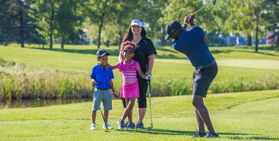 family golfing